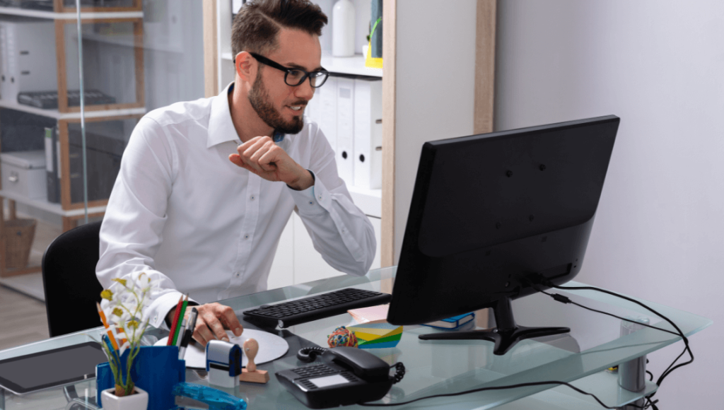 Why A Professional Website Is Crucial For Your Business Success 3 Professional Website Designer Sitting At A Desk Looking At A Computer Screen Https://Websitedesignstlouis.com/