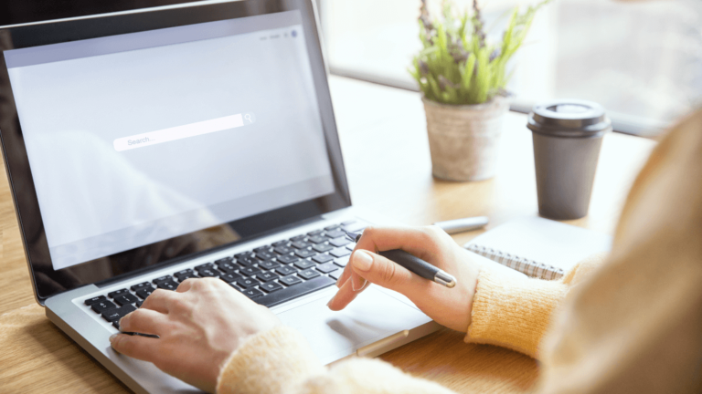 A Person Using A Laptop Https://Websitedesignstlouis.com/
