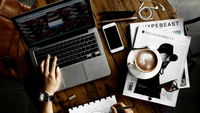 Blog Content Writing Done In Laptop On A Table With Magazines Ask Us. Https://Websitedesignstlouis.com