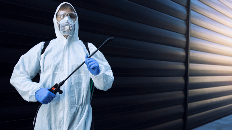 Pest Exterminator In White Suit And Equipment Https://Websitedesignstlouis.com