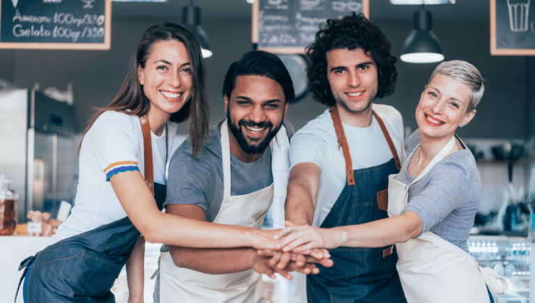 A Group Of People In Aprons With Their Hands Together Https://Websitedesignstlouis.com/