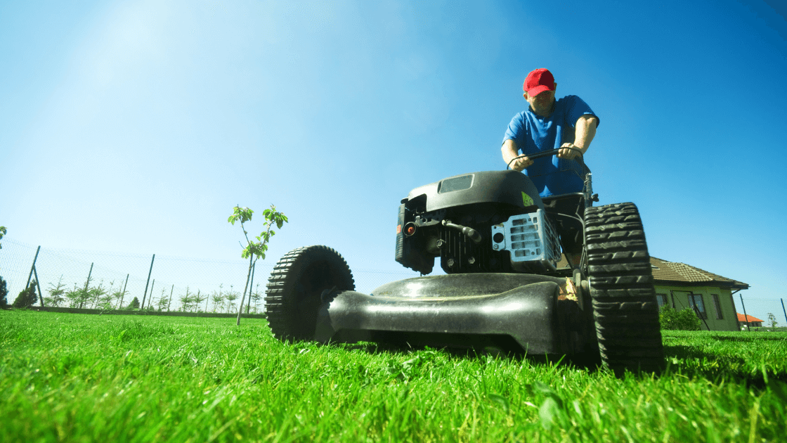 A Man Riding A Lawnmower On Grass Https://Websitedesignstlouis.com/